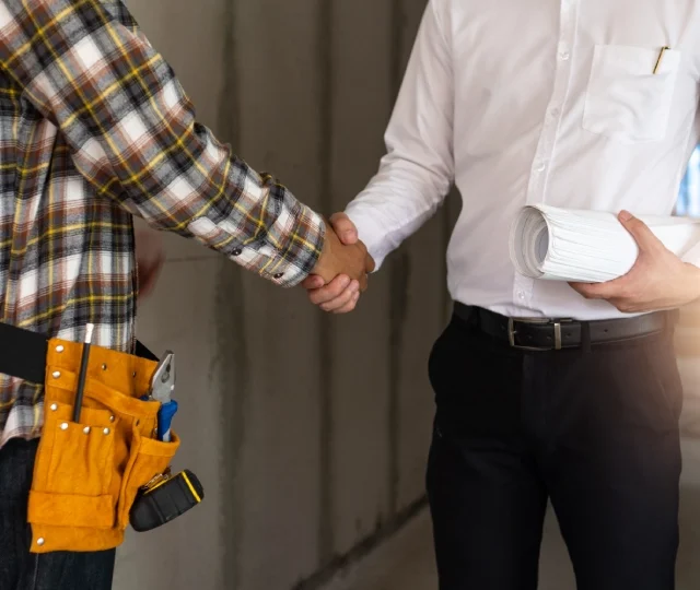 midsection-man-holding-woman-standing-by-people